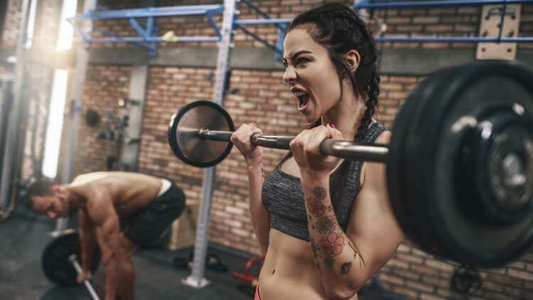Woman burning belly fat at the gym