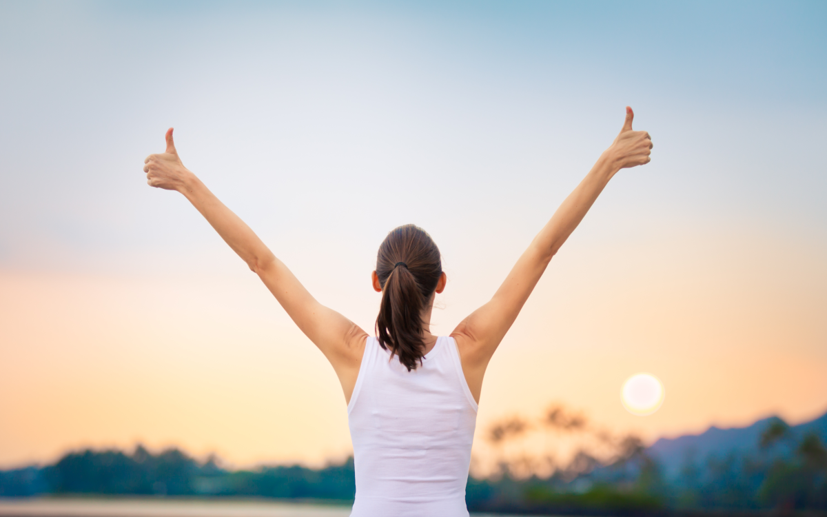 woman with her hands in the air
