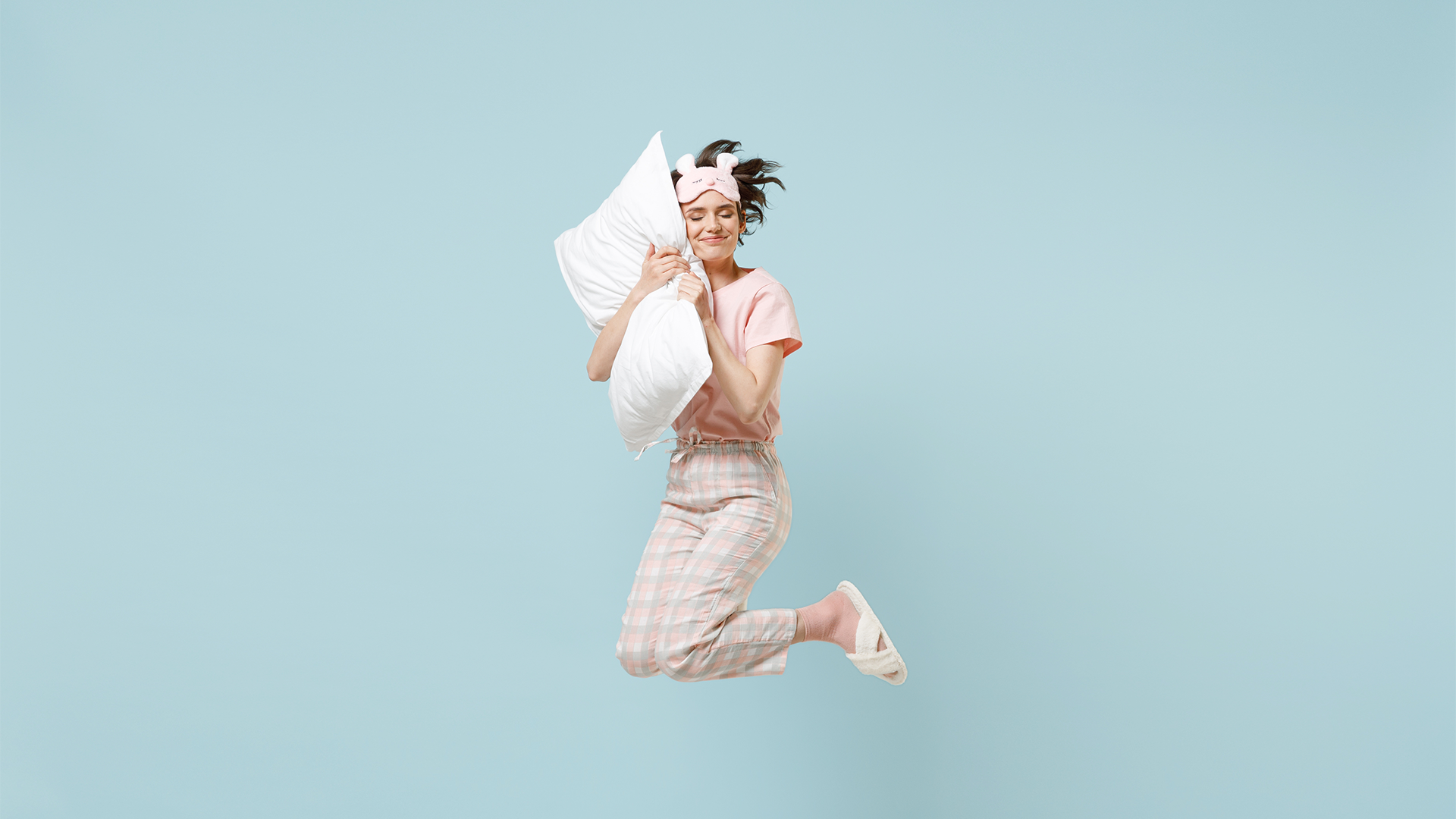 Woman jumping up after a deep sleep